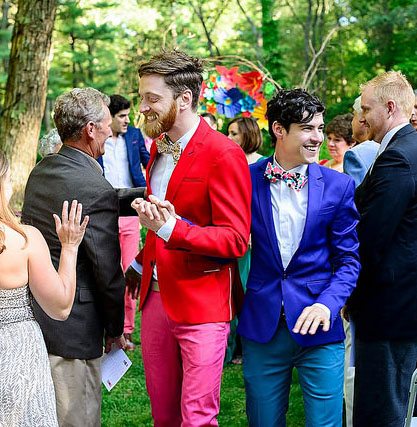 two men in colourful red and blue jackets