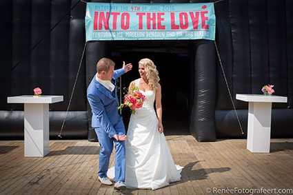 Festival themed wedding aesthetictradition for a millennial couple standing outside a festival tent