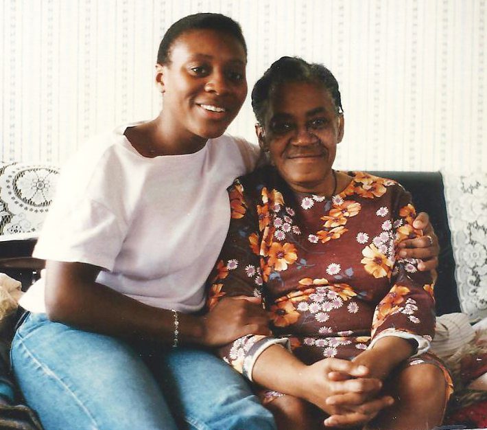 Celebration of Life Eulogy daughter hugging her mum while sitting on a sofa