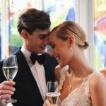 midweek weddings Amsterdam bride and groom drinking champagne