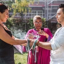 marriage officiant wofting a feather during smugding ritual
