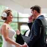 brides questions about marriage bride holding grooms hand, as he wipes a tear away from his cheek