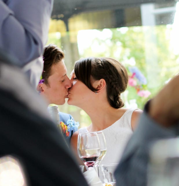 Waterside wedding venues groom and bride kissing