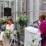 Mixed Faith Weddings bride and groom laughing with the celebrant