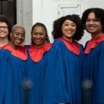 black gospel choirs 5 well-dressed singers performing at witte kerkje in Terheijden