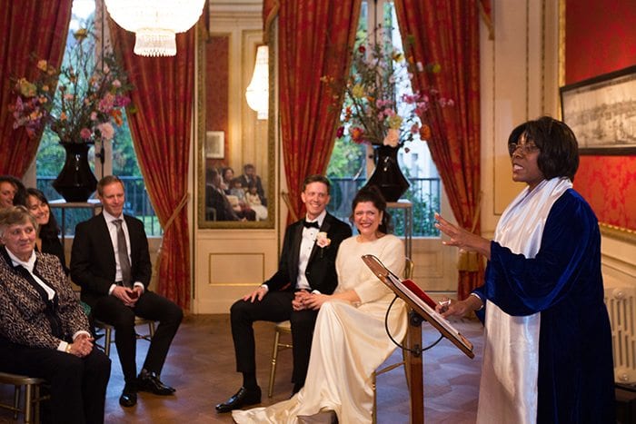 Museum Het Grachtenhuis Herengracht Wedding Venue - Review couple smiling at the celebrant conducting the ceremony at Herengracht museum, Amsterdam