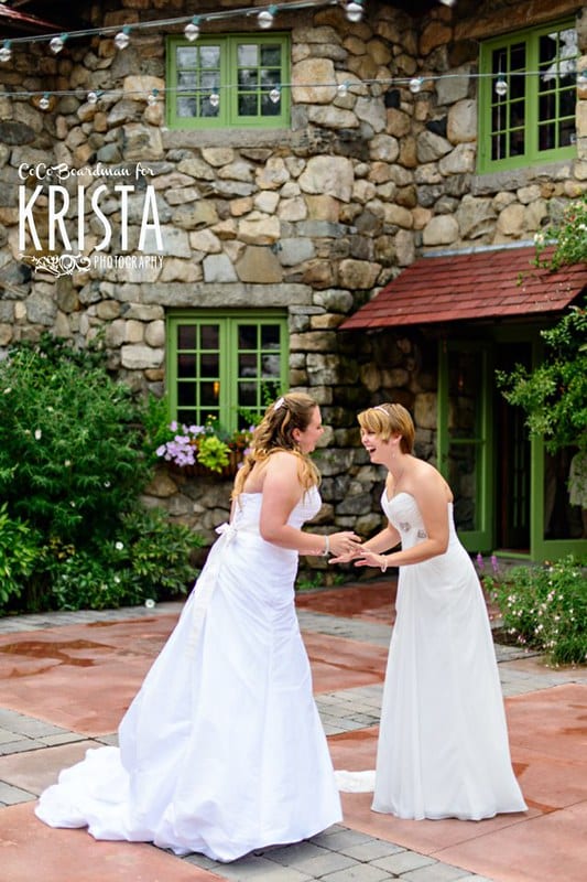 Wedding ceremony readings two women laughing and holding hands Same sex wedding at Willowdale Estate (Topsfield, MA) ©2013 CoCo Boardman/Krista Photography www.kristaphoto.com