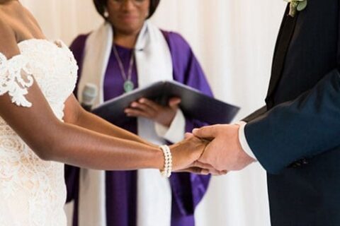 unofficial wedding ceremony, Commitment ceremony, an alternative wedding, celebrates the wedding separately, the bride and groom holding hands, and the officiant giving a blessing to the newlyweds at the Waldorf Hotel Amsterdam.