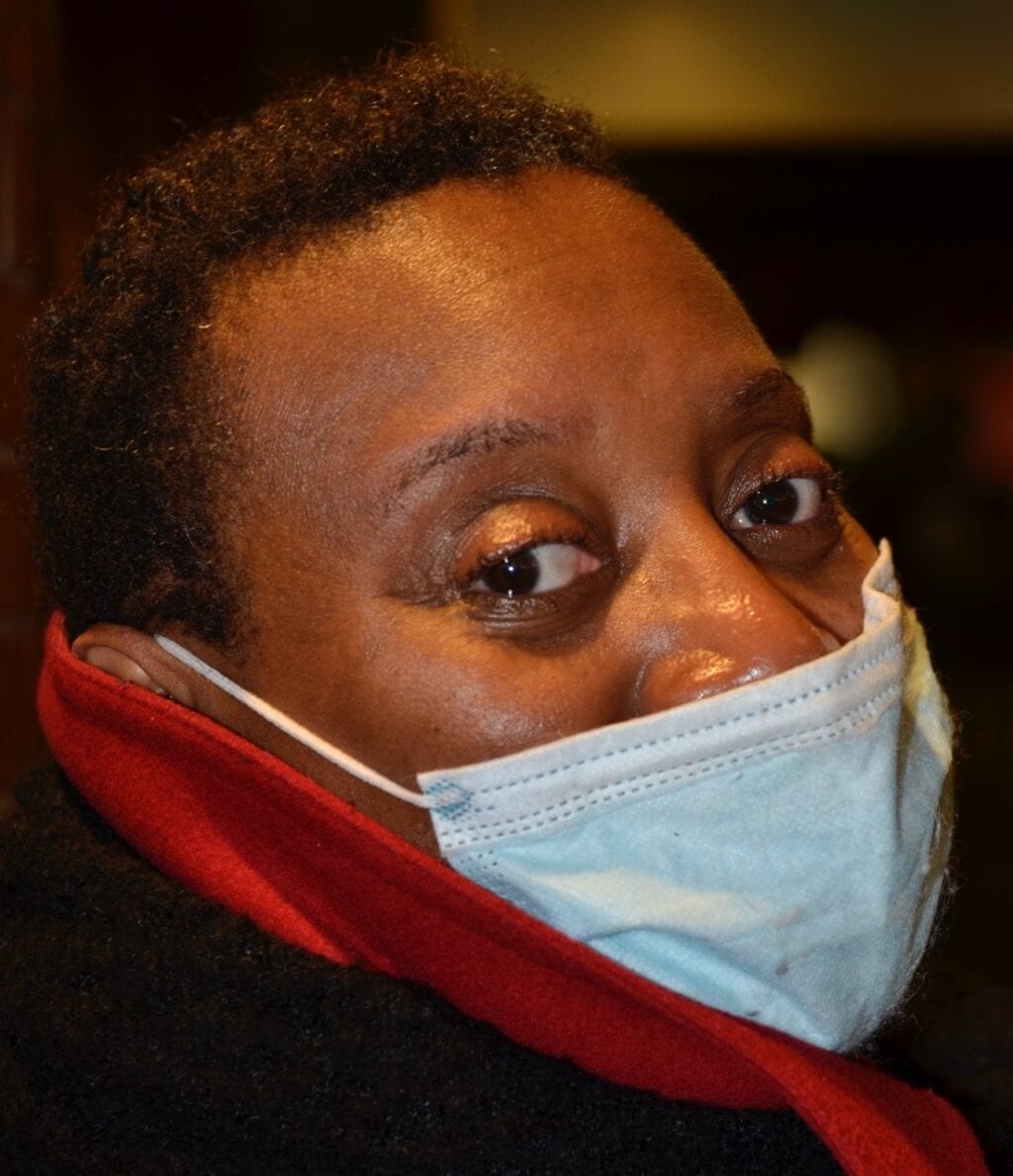 clover jean woman wearing surgical face mask during Covid-19 outbreak