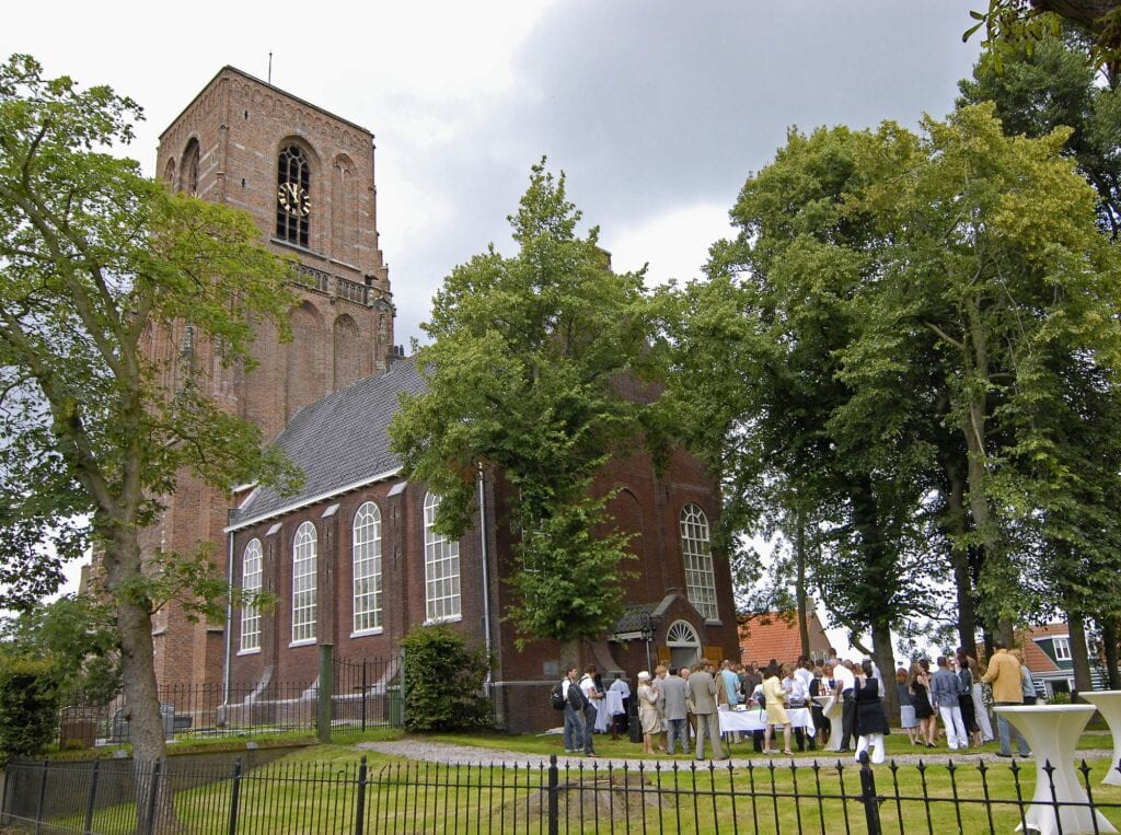 Alternative Amsterdam wedding venues outdoor church marriage service with bridal couple andguests