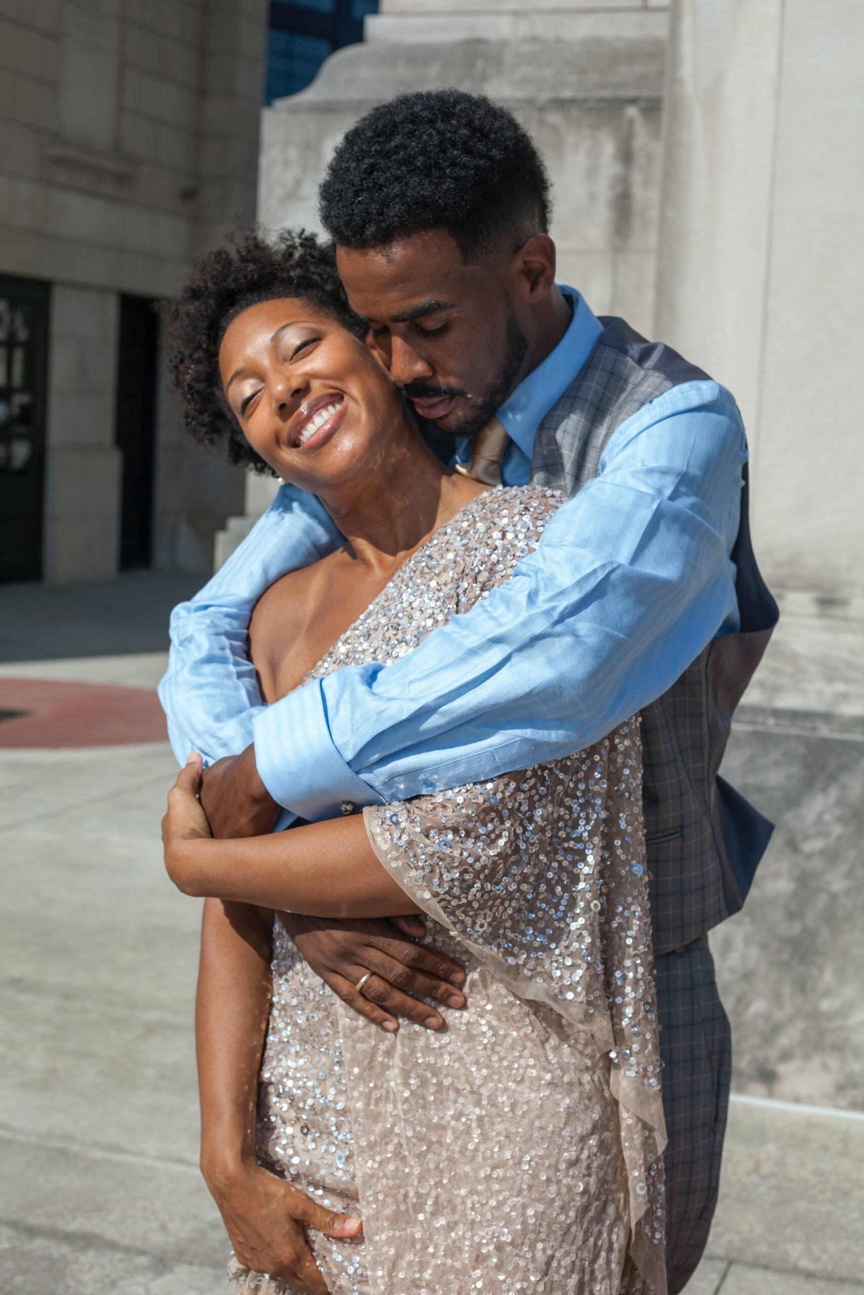 beautiful black couple standing lovingly embraced