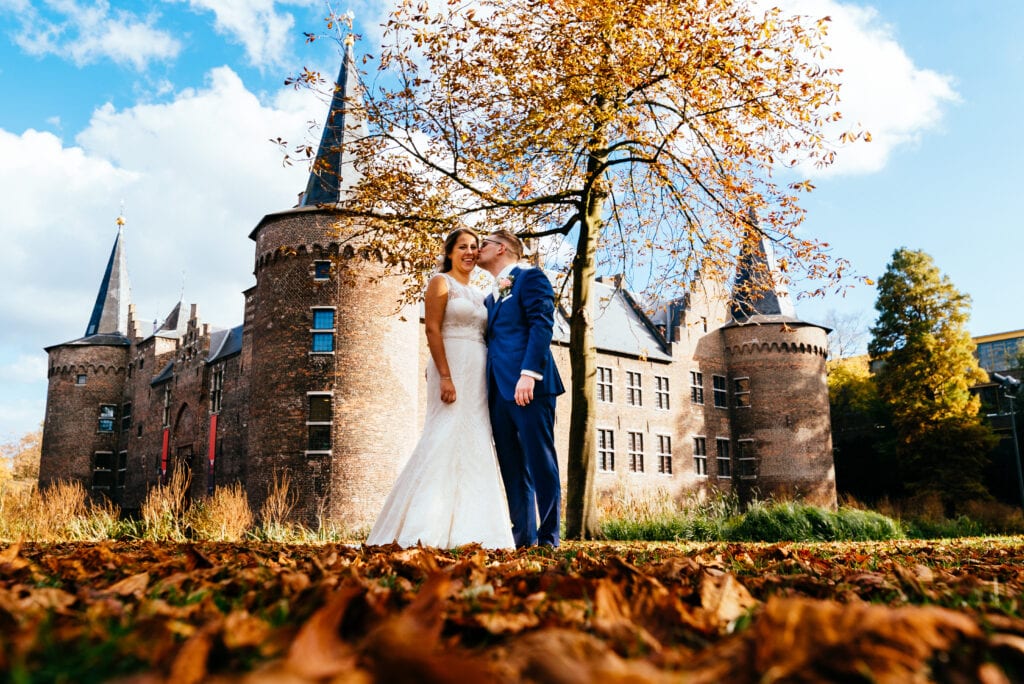 Dutch castle wedding venues happy couple outside man wearing boutonniere