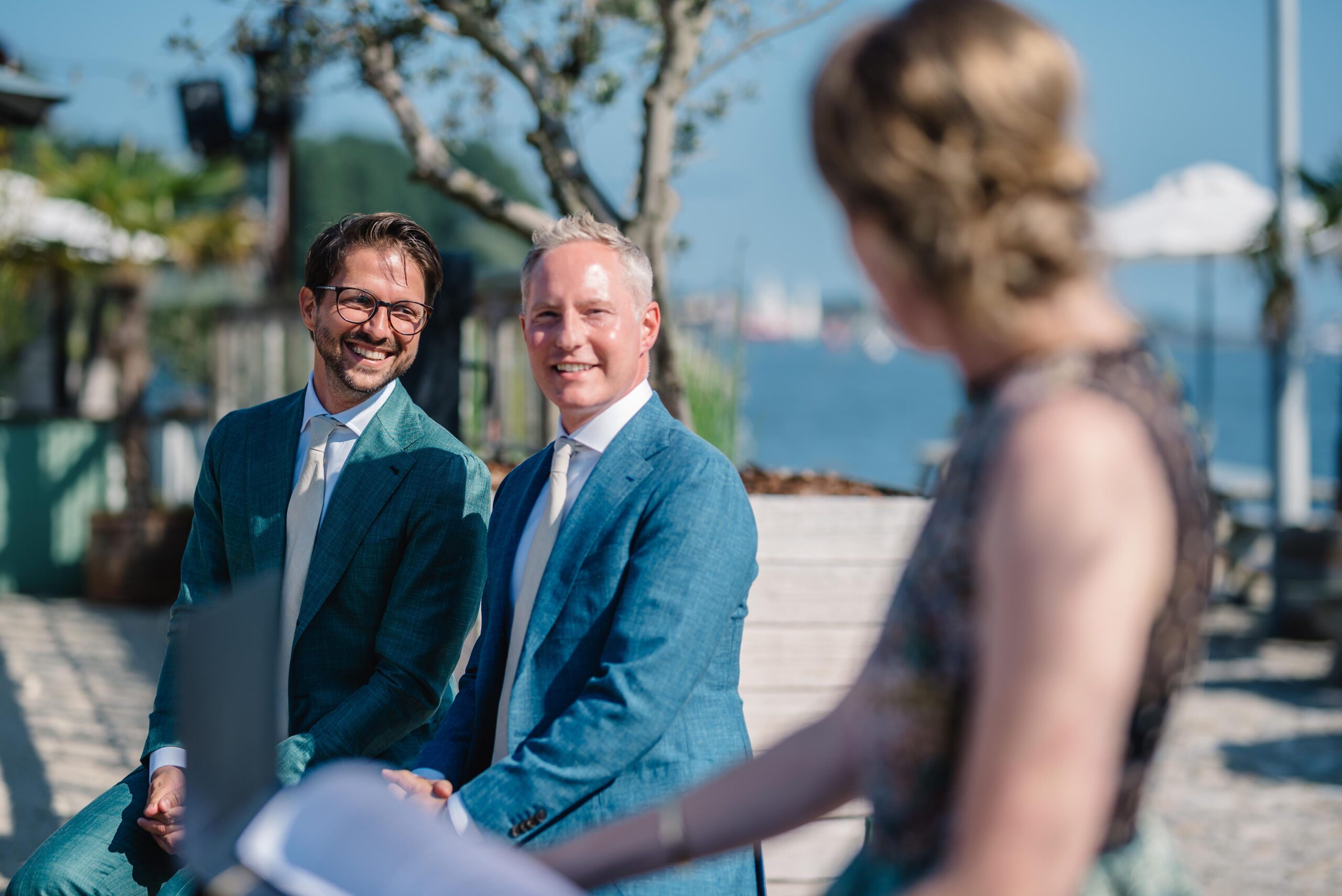 Symbolic wedding blessing ceremony planning gay couple holding hands