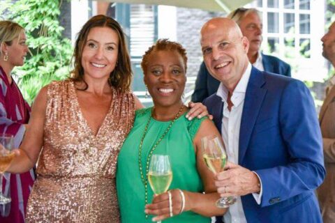 Luxury wedding officiant with bride and groom discussing Dutch wedding guide for couples getting married in the Netherlands.