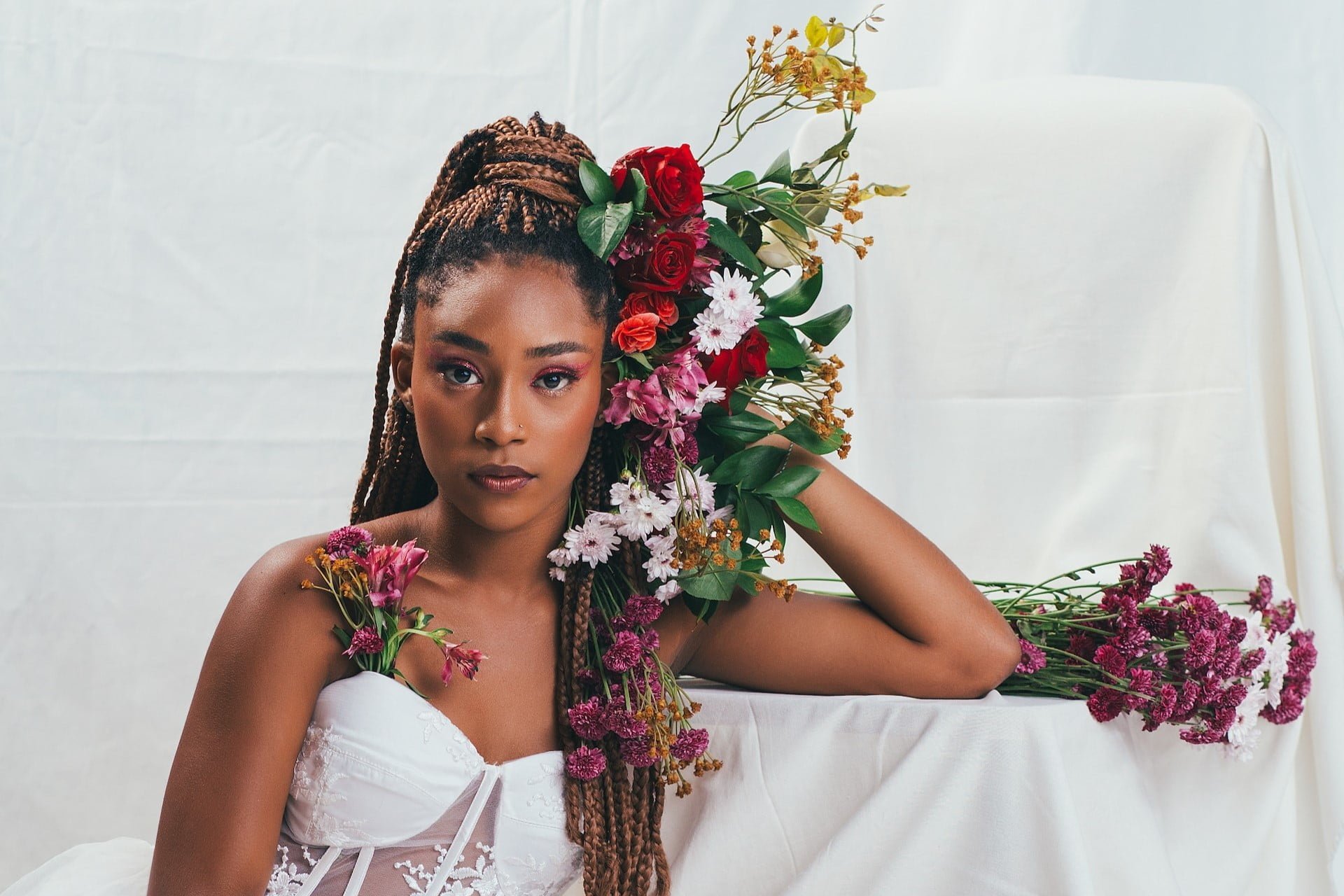 woman with braids in white bridal outfit - jballa photography unsplash