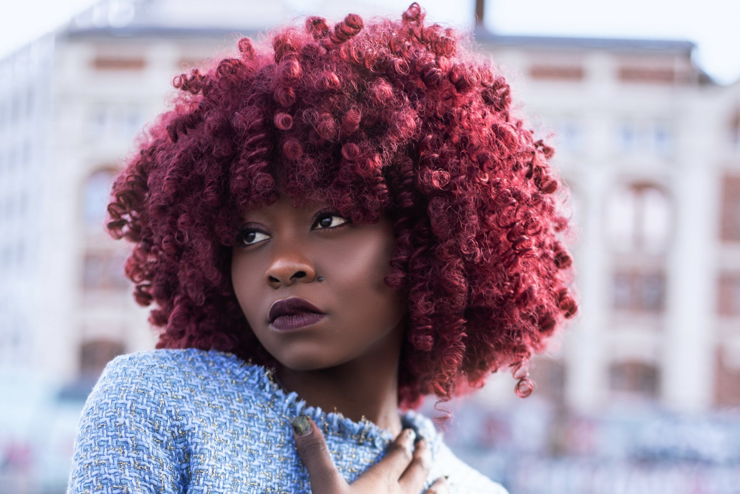 Bride of colour with a black and red ombre afro hairstyle.