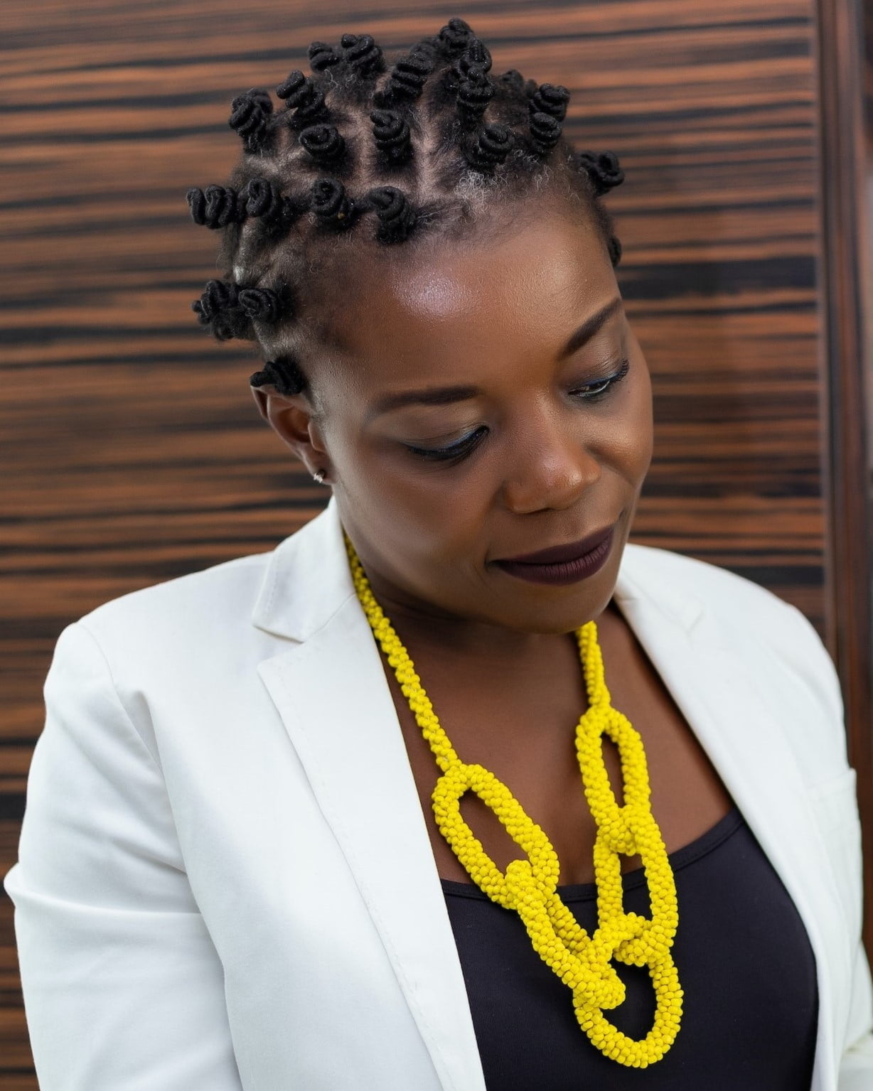 Woman of colour with natural wedding hairstyle Bantu knots 