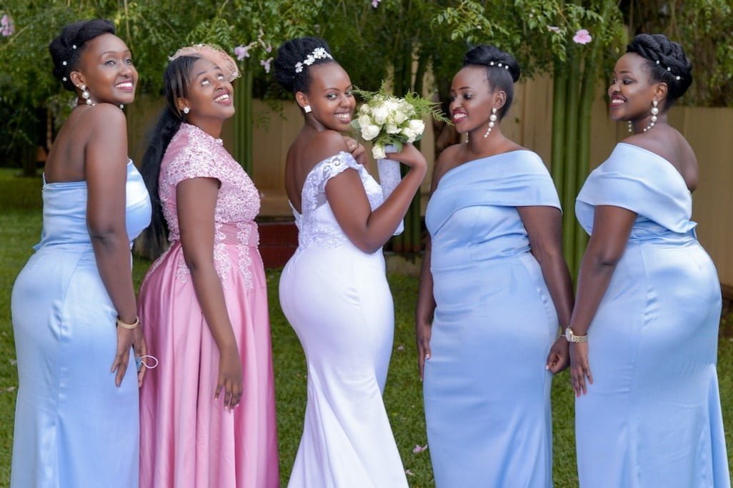 Spring and summer bridesmaids wearing pink and lilac dress colour trends