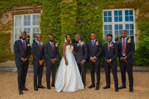 Midweek weddings for the bride and groom standing outside a stately home wedding venue during a weekday wedding.