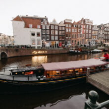 Canalside in the Jordaan couple getting married aboard a boat in Amsterdam imagelana wedding photography