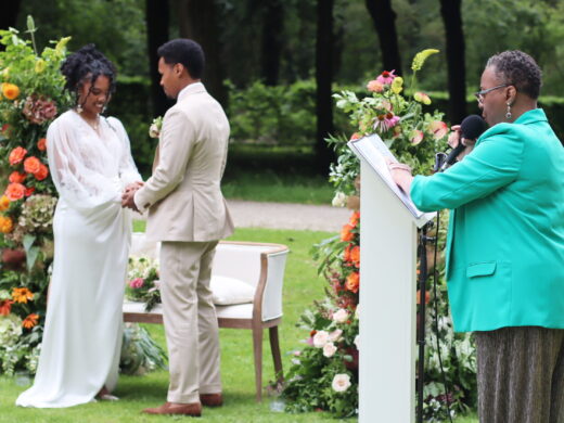 Black wedding celebrant A commitment ceremony featuring a officiant where a man and woman marry in Amsterdam.