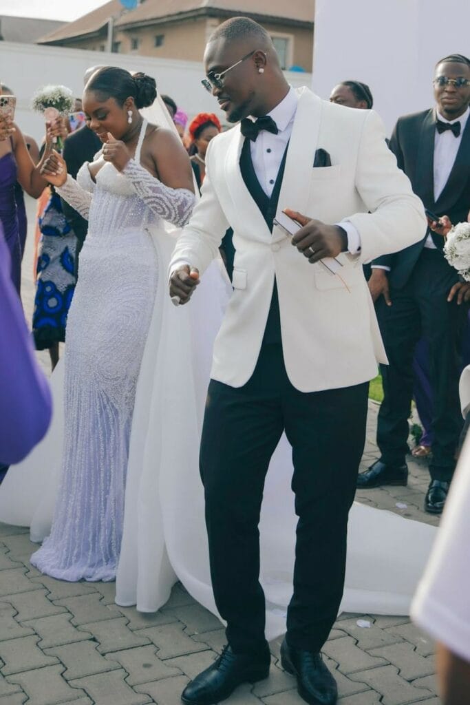  man and woman dancing during a ceremony of love.