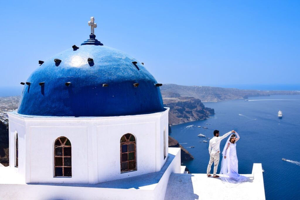 bride and groom dancing at the ceremony on Santorini island, Greece. 