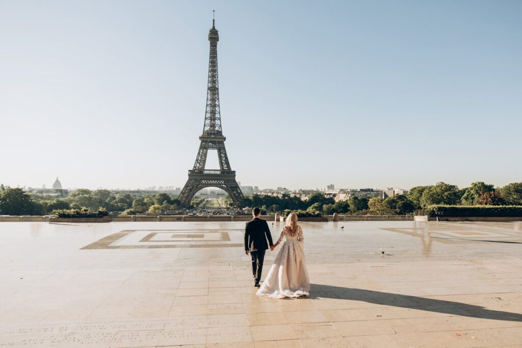 A romantic couple in Paris, near the Eiffel Tower.