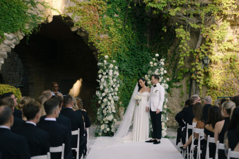 fusion wedding ceremony: international wedding officiant with bride and groom leaving La Baronia, Barcelona wedding venue.