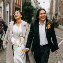 woman and man from Mexico laughing during an elopement wedding shoot in Amsterdam